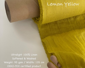 May include: A roll of lemon yellow ultralight 100% linen fabric. The fabric is softened and washed, with a width of 135 cm. The text "Lemon Yellow" is written on the fabric. The fabric is an OEKO-TEX certified product.