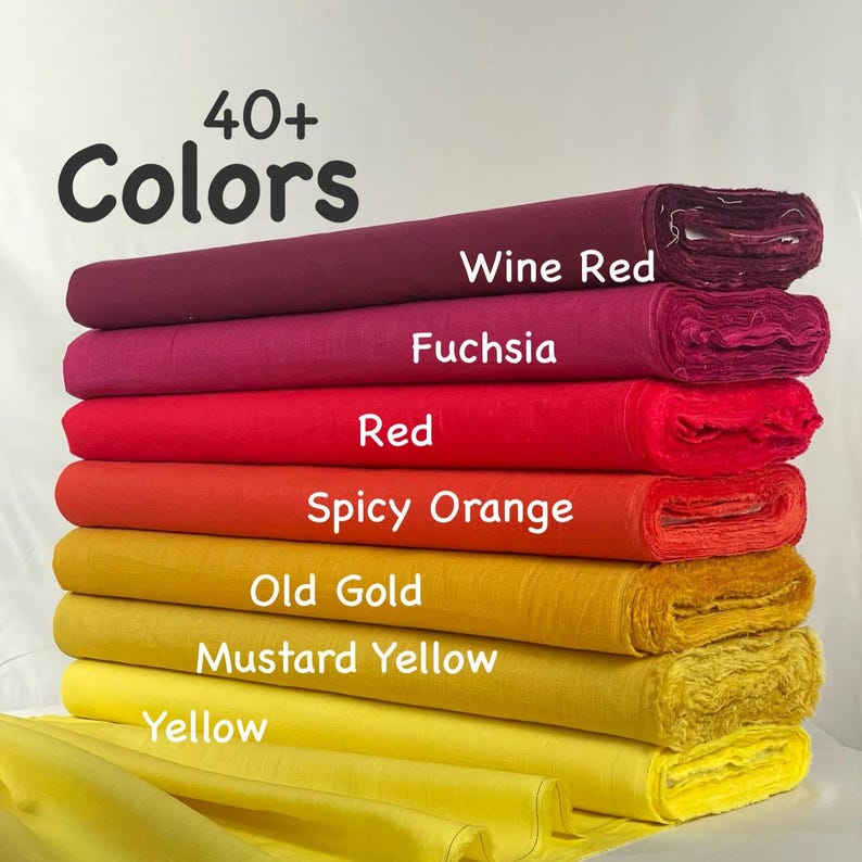 May include: A stack of seven fabric bolts in a gradient of warm colors, including wine red, fuchsia, red, spicy orange, old gold, mustard yellow, and yellow. The text 40+ Colors is printed at the top, with labels identifying each fabric color.