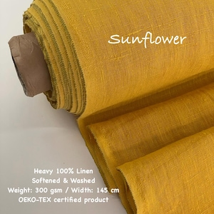 May include: A roll of sunflower yellow 100% linen fabric. The fabric is softened and washed, with a weight of 300 gsm and a width of 145 cm. The text "Sunflower" is visible on the fabric. The fabric is OEKO-TEX certified.