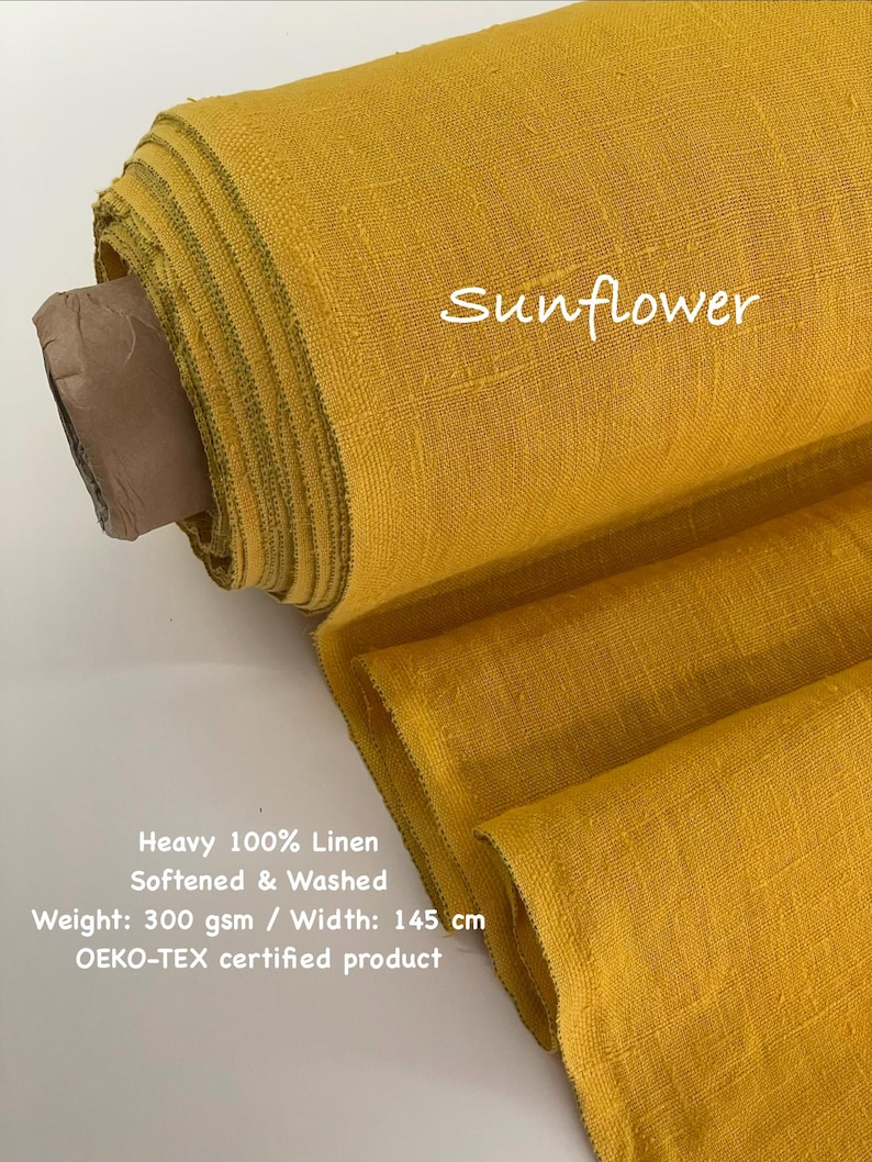May include: A roll of sunflower yellow 100% linen fabric. The fabric is softened and washed, with a weight of 300 gsm and a width of 145 cm. The text "Sunflower" is visible on the fabric. The fabric is OEKO-TEX certified.