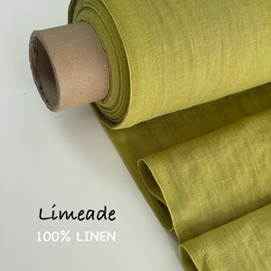 May include: A roll of limeade colored fabric made of 100% linen. The textile features a visible woven texture and is wrapped around a cylindrical cardboard core. The text Limeade 100% LINEN is printed in black on the left side of the image.