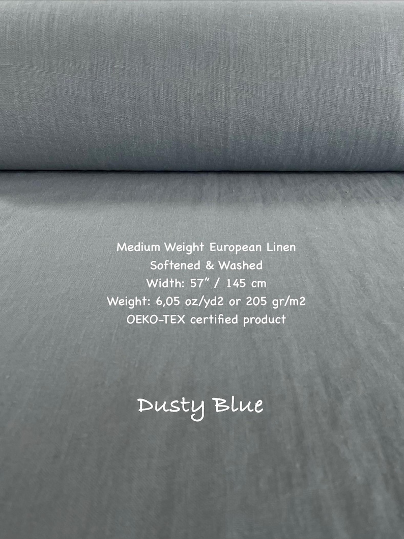 May include: A bolt of dusty blue medium weight European linen fabric. The text reads: Medium Weight European Linen, Softened & Washed, Width: 57", Weight: 6.05 oz/yd2, OEKO-TEX certified product, Dusty Blue.
