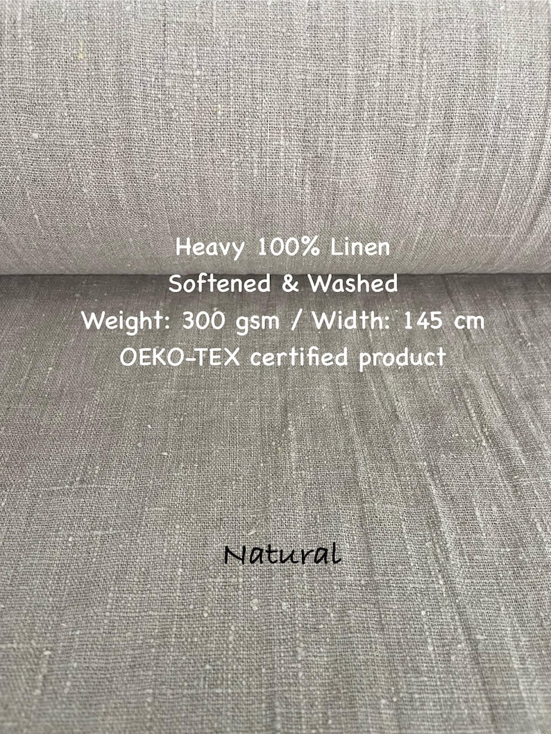 May include: A roll of natural-colored, heavy 100% linen fabric. The fabric is softened and washed, with a weight of 300 gsm and a width of 145 cm. The text "Natural" is written on the fabric. The product is OEKO-TEX certified.