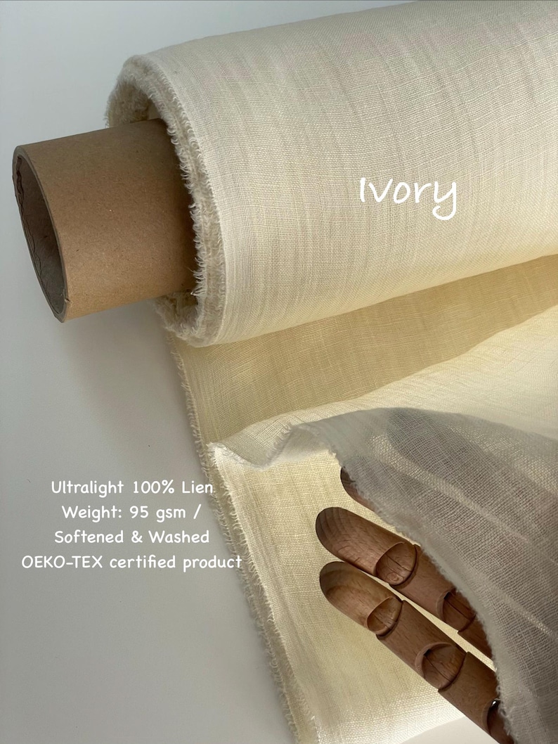 May include: Ivory-colored linen fabric roll. The text on the image reads "Ultralight 100% Lien, Weight: 95 gsm / Softened & Washed, OEKO-TEX certified product". The fabric is a light, natural color, and the roll is partially unraveled, showing the texture.