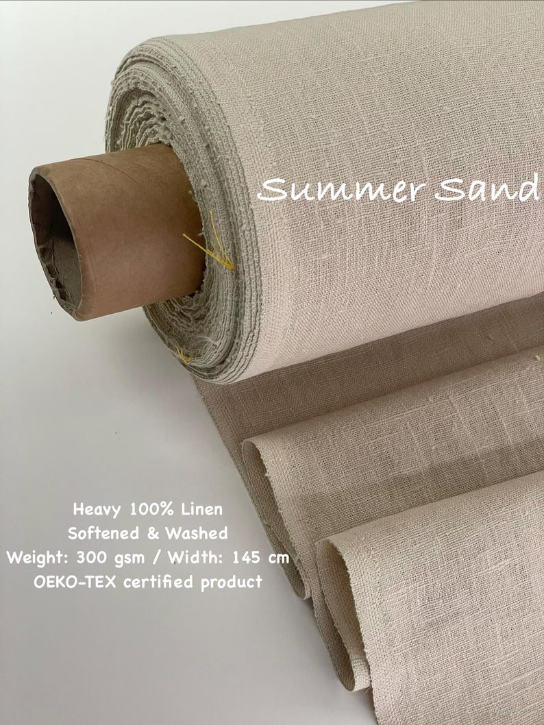 May include: A roll of beige linen fabric labeled "Summer Sand." The fabric is heavy, 100% linen, softened, and washed. The weight is 300 gsm, and the width is 145 cm. The product is OEKO-TEX certified.