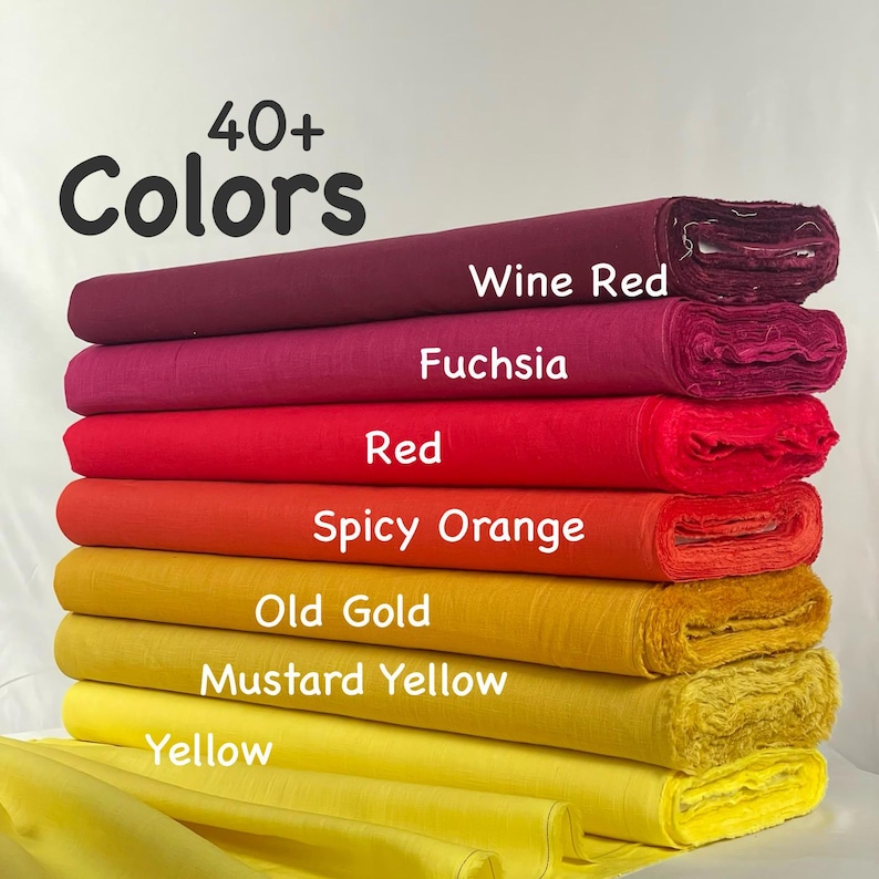 May include: A stack of fabric bolts in a gradient of colors including wine red, fuchsia, red, spicy orange, old gold, mustard yellow, and yellow. The text 40+ Colors is printed at the top, with labels identifying each specific fabric shade.