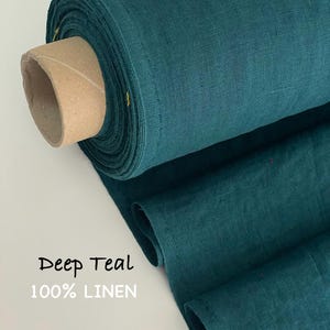 May include: A roll of deep teal 100% linen fabric with a visible woven texture. The fabric is wrapped around a cylindrical cardboard core. The text Deep Teal 100% LINEN is printed on the lower left side of the image in a simple black and white font.
