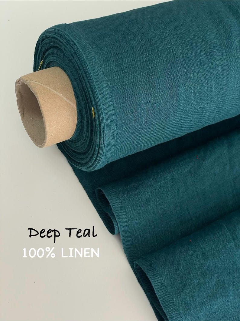 May include: A roll of deep teal 100% linen fabric with a visible woven texture. The fabric is wrapped around a cylindrical cardboard core. The text Deep Teal 100% LINEN is printed on the lower left side of the image in a simple black and white font.