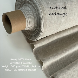 May include: A roll of natural melange linen fabric. The fabric is heavy, 100% linen, softened, and washed. The weight is 300 gsm, and the width is 145 cm. The fabric is OEKO-TEX certified.