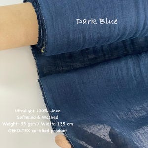 May include: Dark blue ultralight 100% linen fabric, softened and washed. The fabric roll displays the text "Dark Blue". The weight is 95 gsm, and the width is 135 cm. OEKO-TEX certified product.