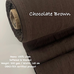 May include: A roll of chocolate brown heavy linen fabric. The fabric is softened and washed, with a weight of 300 gsm and a width of 145 cm. The text "Chocolate Brown" is displayed on the fabric. The product is OEKO-TEX certified.