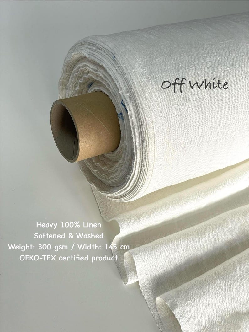 May include: Off-white linen fabric roll. The fabric is labeled "Off White" and is described as heavy 100% linen, softened, and washed. The width is 145 cm. The product is OEKO-TEX certified.
