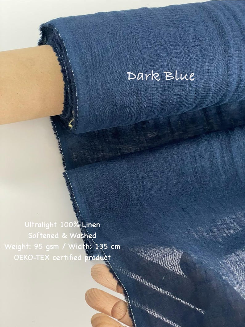 May include: Dark blue ultralight 100% linen fabric, softened and washed. The fabric roll displays the text "Dark Blue". The weight is 95 gsm, and the width is 135 cm. The fabric is an OEKO-TEX certified product.