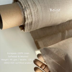May include: A roll of beige European 100% linen fabric. The fabric is softened and washed, with a width of 53 inches. The text "Beige" is visible on the fabric. The product is an OEKO-TEX certified product.