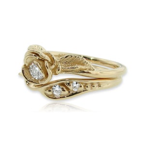 Side view of yellow gold rose and leaf wedding ring set with diamonds