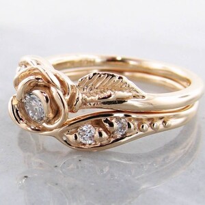 Side view of yellow gold rose and leaf wedding ring set with diamonds
