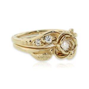 Side view of yellow gold rose and leaf wedding ring set with diamonds