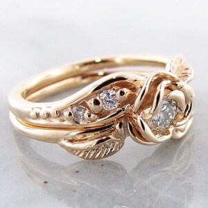 Side view of yellow gold rose and leaf wedding ring set with diamonds