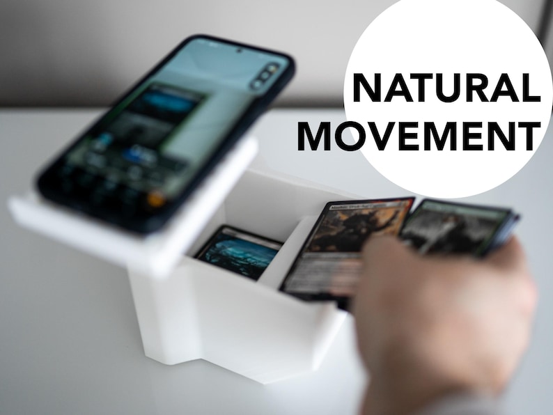 3D-printed white trading card scanner and dispenser tray with a built-in phone stand. Designed for TCG, MTG, Pokémon, and Lorcana, allowing easy card scanning with apps like Manabox, TCGPlayer, and Delver Lens. Perfect for collectors and sellers.