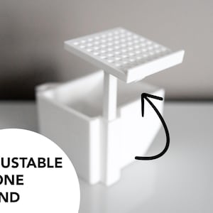 3D-printed white trading card scanner and dispenser tray with a built-in phone stand. Designed for TCG, MTG, Pokémon, and Lorcana, allowing easy card scanning with apps like Manabox, TCGPlayer, and Delver Lens. Perfect for collectors and sellers.