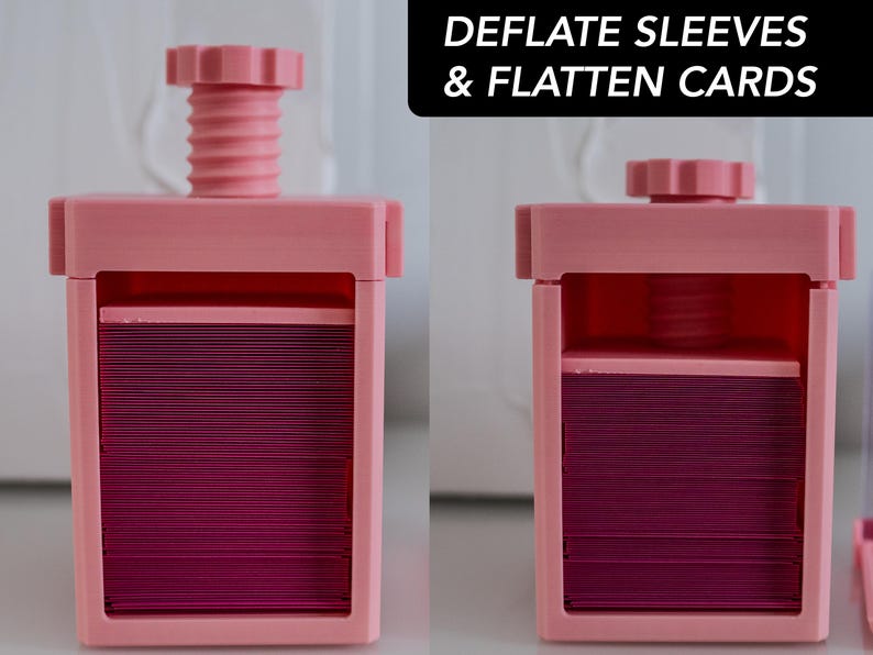 May include: A pink plastic device with a handle on top. The device is used to deflate card sleeves and flatten cards. The text "DEFLATE SLEEVES & FLATTEN CARDS" is printed on the top of the image.