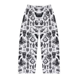 May include: Black and white patterned pajama pants. The pants feature a repeating pattern of various gothic and occult symbols, including skulls, octopuses, butterflies, and ornate clocks, set against a white background. The pants have a wide-leg design.