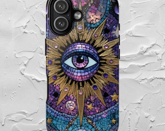 May include: A phone case with a mosaic design featuring an eye at the center, surrounded by a golden sunburst. The case has a purple, blue, and gold color scheme with star and moon accents. The case has a dual camera.