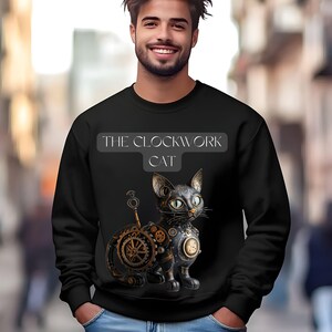May include: A black sweatshirt with a graphic of a steampunk cat with gears and a key. The text "THE CLOCKWORK CAT" is printed above the cat.