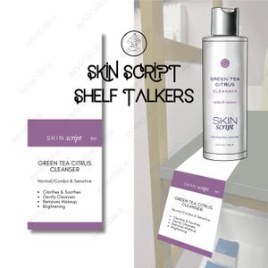 May include: A Skin Script Green Tea Citrus Cleanser bottle and shelf talkers. The bottle is white with a silver cap and the text "Green Tea Citrus Cleanser" and "calm & restore". The shelf talkers are purple and white.