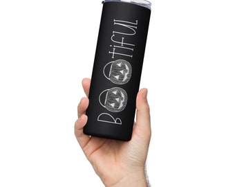 May include: Black stainless steel tumbler with a white design that says "Boo-tiful" with three jack-o'-lantern faces.