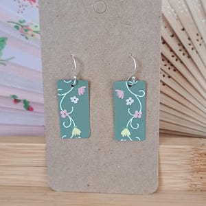 Upcycled tin earrings with green floral pattern. Recycled tin, sustainable, eco-friendly, lightweight jewellery.