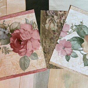 May include: Three strips of wallpaper featuring floral patterns. The left strip displays large deep red and pink roses with green leaves on a textured beige background. The center strip is dark brown with floral details. The right strip shows pink and tan flowers.