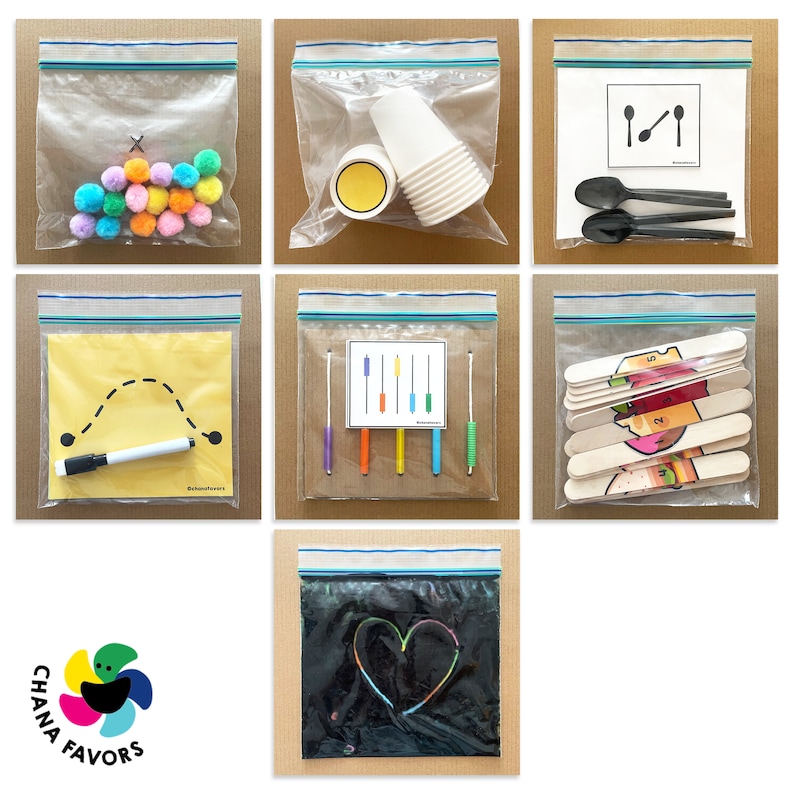 May include: Six clear plastic bags with zipper closures, each containing different craft supplies. The bags contain colorful pom-poms, plastic cups, a white marker, wooden craft sticks, popsicle sticks with numbers, and a black sheet of paper.
