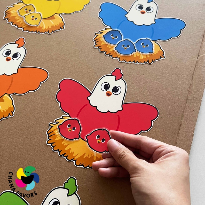 May include: A set of colorful felt chicken cutouts with chicks in their nests. The chickens are red, blue, yellow, and orange. The chicks are all yellow.