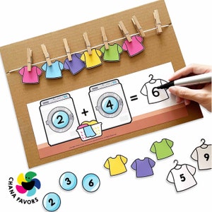 Laundry Line Math Printable featuring washing machines and clothesline with clothespins. Printable for instant download by Chanafavors. Available on Etsy store.