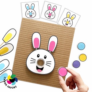 Cover image featuring colorful rabbit faces with various colored ears and noses, representing the Rabbit Roll & Match Printable game for kids by Chanafavors