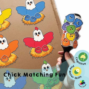 May include: A colorful chick matching game with a red, orange, blue, and green chick with chicks in their nests. The game is designed to help children develop fine motor skills and cognitive skills. The game includes a set of chicks and nests, as well as a set of matching cards. The game is suitable for children ages 3 and up.