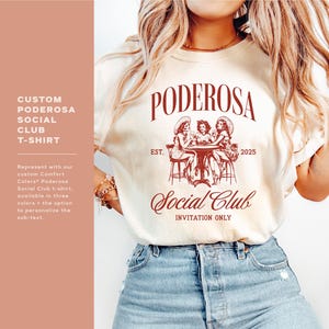May include: A white t-shirt with a red graphic design that says "PODEROSA Social Club" with the text "EST. 2025" and an illustration of three women sitting at a table.