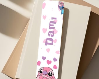 May include: Pink and blue Stitch character bookmark with a white background and pink hearts. The bookmark has the name "Dami" written in purple.