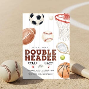 May include: A watercolor-style invitation with sports equipment illustrations, including a soccer ball, football, baseball, basketball, tennis racket, and a basketball hoop. The invitation text reads "DOUBLE HEADER" with details for a birthday party.