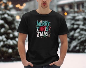 Camiseta con gráfico festivo de Feliz Navidad, camiseta de temporada navideña, diseño de muñeco de nieve y árbol navideño, camiseta navideña con bastón de caramelo