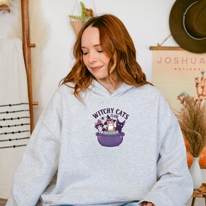 Witchy Cats Club Hoodie: Spooky Halloween Cat Sweatshirt