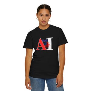 May include: Black t-shirt with the text "fuck AI" in a red, white, and blue design. The "A" is red, the "I" is white, and the letters are separated by a design that resembles the American flag.