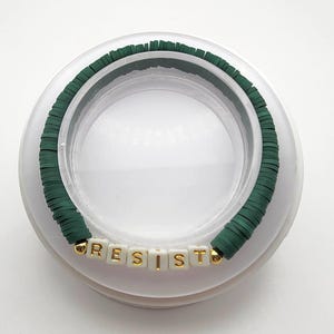 Resist Handcrafted Stretch Bracelet.
