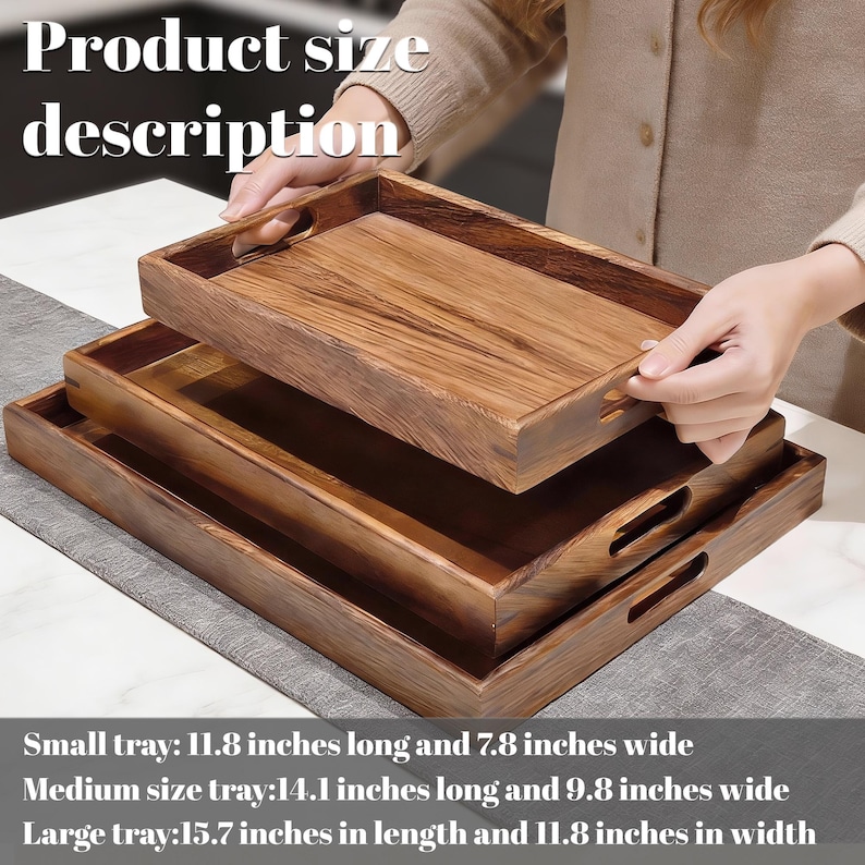 May include: Three wooden serving trays of varying sizes, stacked. The top tray is being held by a person. The trays are rectangular with built-in handles. The text "Product size description" is at the top. The small tray is 11.8 inches long and 7.8 inches wide.