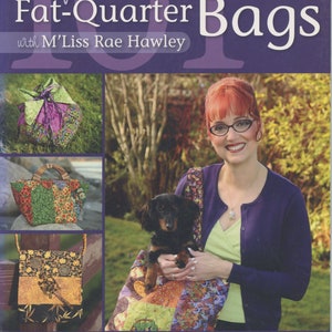 May include: A book titled "101 Fabulous Fat-Quarter Bags" with M'Liss Rae Hawley. The book cover features a woman holding a dachshund in a colorful patchwork bag. The book cover also features three smaller images of patchwork bags.