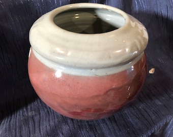 wide red and white bowl-shaped vase