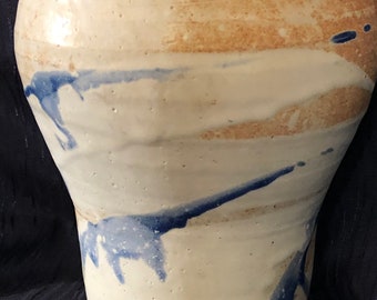 pale vase with blue markings