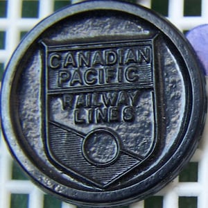 Canadian Pacific Railway Button early black plastic uniform - ww2? CPR Railroad lines