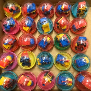62 Toy Truck Capsules for Vending Machines 1980s 1990s lot tanker cement dump tow wrecker 2 inch and egg capsules
